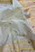 Off white Kadhiyal border tissue silk (Saree)