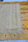 Off white Kadhiyal border tissue silk (Saree)